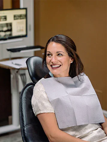 A smiling patient in the dental chair